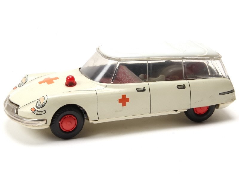 TIPPCO (Allemagne) Citroën ID 19 break Ambulance en tôle lithographiée, long 23cm, gyrophare avec système de pierre à briquet et un blessé sur brancard, crème - Rare -.jpg